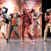 Group of men dancing in Guys and Dolls, 2023