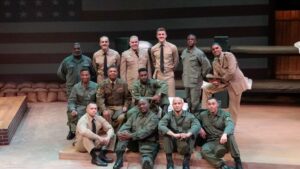 A group of actors in military costumes.