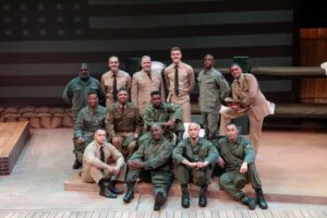 A group of actors in military costumes.