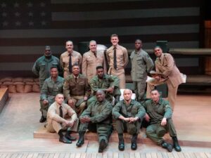 A group of actors in military costumes.