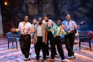 Group of dapper dressed men in show