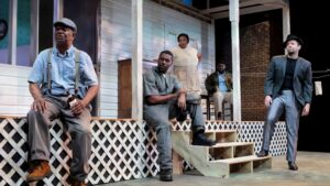 Scene from August Wilson's Fences - people sitting on a front porch.