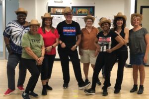 Group of people wearing cowboy hats