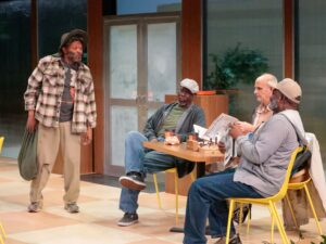 Men sitting around a table in fast food restaurant