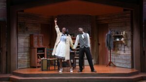 A Man and a woman on stage in old cabin