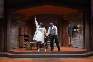 A Man and a woman on stage in old cabin