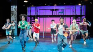 People dancing in colorful outfits